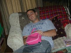 Uncle Dave fast asleep with his hot pink purse