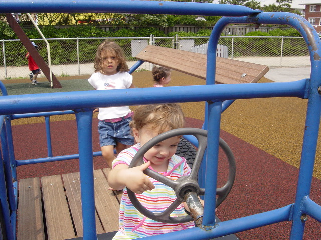 Driving the car at the playground.