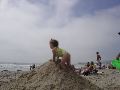 A favorite activity at the beach was building hills and then playing on them.