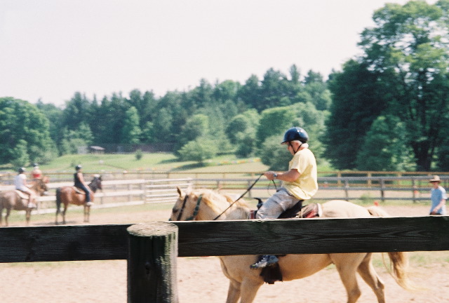 Daddy stopping his horse after a canter.