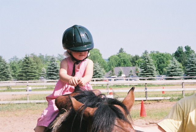 A budding equestrian - but we think she needs a smaller helmet!